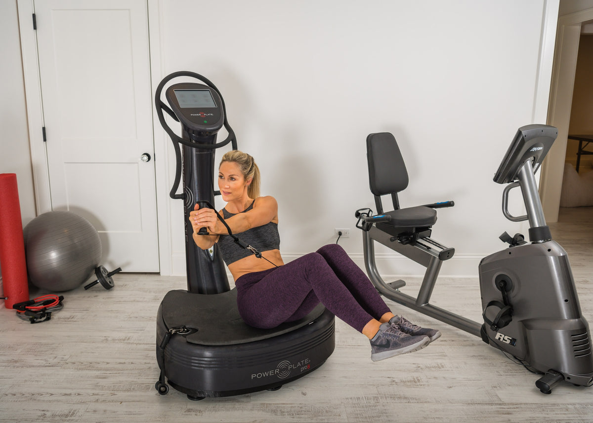 Exercise on the Power Plate pro8 in a gym