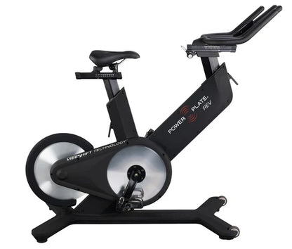 Power Plate REV vibration exercise bike in matte black on white background