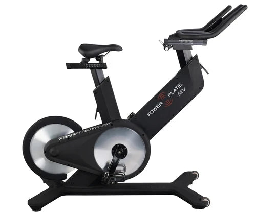 Power Plate REV vibration exercise bike in matte black on white background