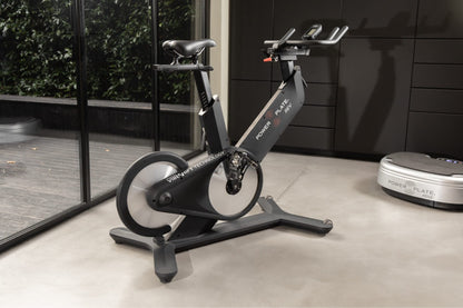 Power Plate REV bike in a modern home