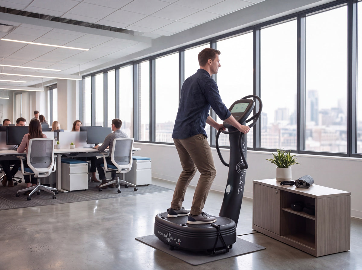 Man training on the Power Plate my8 in a modern office